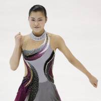 Top of the charts: Kanako Murakami performs her short program at the Four Continents on Thursday in Taipei. Murakami leads the event heading into the free skate. | KYODO