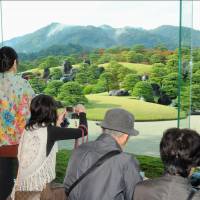 Visitors to the Adachi Museum of Art in Yasugi, Shimane Prefecture, in 2012 admire its 16.5-hectare garden, chosen recently as the best Japanese garden in the world by the U.S. magazine Journal of Japanese Gardening for the 11th year in a row. | KYODO