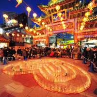 All lit up: Lanterns and candles illuminate Yokohama\'s Ma Zhu Miao Temple. | VIOLA KAM