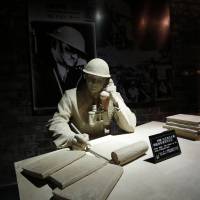 A model and a photograph of John Rabe, sometimes call “China’s Schindler,” are seen in a museum, during a reporting trip in Nanjing, Jiangsu province on Feb. 19, 2014. Rabe, a long-time resident of China from Germany, was head of the International Safety Zone in Nanjing during the December 1937 Nanjing Massacre and he is praised for having helped save the lives of more than 200,000 people who took refuge in the zone. China, eyeing Japan, seeks WWII focus for Xi during Germany visit