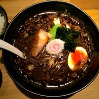 A quick firing in the kitchen gives Gogyo\'s ramen a deep black hue and smoky flavor. | ROBBIE SWINNERTON