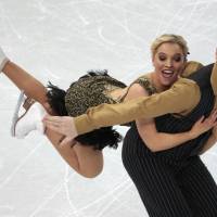 Danielle O\'Brien and Gregory Merriman of Australia perform their ice dancing short dance at the Sochi Winter Olympics on Sunday. | AP