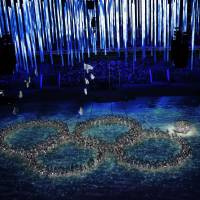 Performers recreate the fifth Olympic ring that didn\'t open in the opening ceremony during the closing ceremony of the 2014 Winter Olympics. | AP