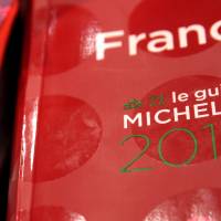 Copies of the new 2014 annual Michelin restaurant guide are presented Monday during the announcement of the newly promoted chefs in Paris. | REUTERS