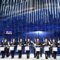 A Russian military drum band performs during the closing ceremony of the 2014 Winter Olympics. | AFP-JIJI