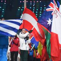 Australian freestyle skier David Morris parades during the closing ceremony. | AFP-JIJI