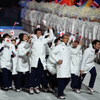 The Japanese delegation enters the stadium during the closing ceremony of the 2014 Winter Olympics. | AFP-JIJI