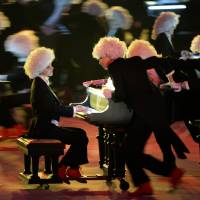 Pianists perform Sergei Rachmaninoff\'s compositions at the closing ceremony of the 2014 Winter Olympics. There were 62 pianos and 248 performers on the stage. | AFP-JIJI