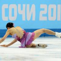Mao Asada falls after her opening triple axel Saturday during the figure skating team ice dance short dance at the Iceberg Skating Palace. | AFP-JIJI