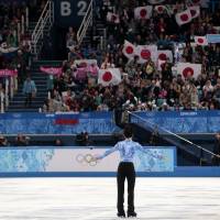 Yuzuru Hanyu of Japan acknowledges the crowd after performing his short program on Thursday.  | AP
