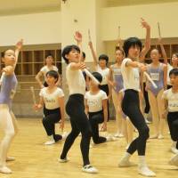 Best feet forward: K-Ballet School pupils practice swordfighting, listen intently and strike classic poses during a rehearsal for ABT\'s \"The Nutcracker.\" | NOBUKO TANAKA