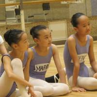 Best feet forward: K-Ballet School pupils practice swordfighting, listen intently and strike classic poses during a rehearsal for ABT\'s \"The Nutcracker.\" | NOBUKO TANAKA
