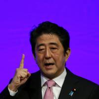 In self-defense: Prime Minister Shinzo Abe addresses the LDP\'s annual convention in Tokyo on Jan. 19. | BLOOMBERG