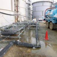 Highly radioactive water that spilled from a storage tank at the Fukushima No. 1 nuclear power plant is seen in this handout photo. | TEPCO/KYODO