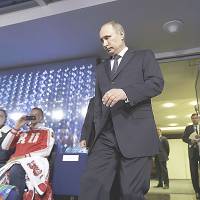 Russian President Vladimir Putin attends the closing ceremony of the Sochi Winter Olympics on Sunday. | REUTERS