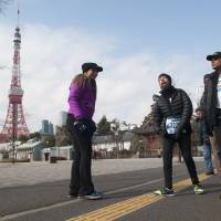 Endurance: Melamed passes Tokyo Tower with the Proyecto Vamos team on his run last Sunday. | NATALIE HOWARD