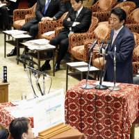 Prime Minister Shinzo Abe answers questions during Thursday\'s session of the Lower House Budget Committee. | KYODO