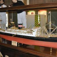 A scale model of the Hikawamaru luxury liner, recently returned to major shipping company NYK Line from the United States, is displayed at the firm\'s museum in Yokohama on Tuesday. | KYODO