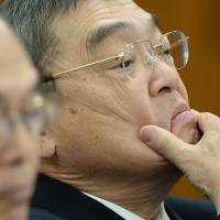 NHK Chairman Katsuto Momii listens to questions from a lawmaker during a parliamentary session Wednesday. NHK chief tells board 'comfort women' remarks no big deal
