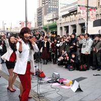 Setting the tone: 7 cm, a group of female pop idols, performs on a street in Tokyo\'s Akihabara district on Jan. 18. | YOSHIAKI MIURA