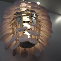 Nature motif: A pine cone-inspired lamp from Panasonic Idemitsu OLED Lighting Co. hangs at the Tokyo Big Sight exhibition. | KAZUAKI NAGATA