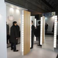 Easy on the eyes: People check out Panasonic Idemitsu\'s OLED panels at Tokyo Big Sight. | KAZUAKI NAGATA
