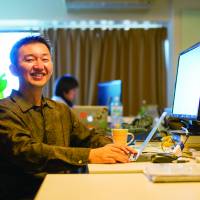 Voyagin Pte. President Masashi Takahashi poses in his office in Meguro Ward, Tokyo. | WEDGE