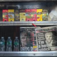 Fallen star: A street vendor displays local newspapers featuring the late actor Philip Seymour Hoffman in New York on Tuesday. Police: Hoffman's heroin didn't have additive