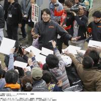 Man in demand: Former Yomiuri Giants and MLB star Hideki Matsui, back with Yomiuri as an invited coach during spring training, prepares to sign autographs for fans on Saturday in Miyazaki Prefecture. Spring training opened on Saturday for NPB\'s 12 teams. | KYODO