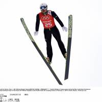 Like a bird: Yoshito Watabe soars through the air during the men\'s individual normal hill training for the Nordic combined 10-km event on Tuesday in Sochi, Russia. | GETTY IMAGES/KYODO
