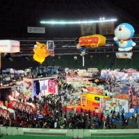 Game\'s up: Pikachu and Doraemon watch over Next Generation World Hobby Fair. |  KAORI SHOJI