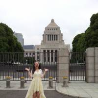 Brush with politics: TV personality Haruka Christine stands outside the Diet building in Tokyo\'s Nagata-cho district. | YOSHIAKI MIURA