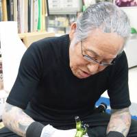 Master at work: Horiyoshi III works at his studio in Yokohama. | JON MITCHELL