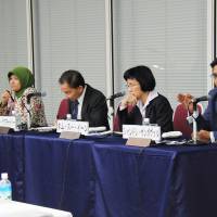 Shandre Thangavelu from Singapore answers a question from the audience as fellow panelists listen at an ASEAN symposium in Tokyo on Feb. 27. | SATOKO KAWASAKI