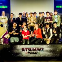 Award winners and BitSummit organizers pose with Kyoto mascot Mayumaro. | DYLAN CUTHBERT