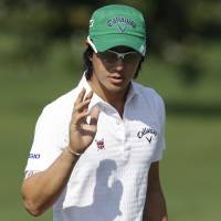 Watch the birdie: Ryo Ishikawa waves to the gallery after sinking a putt at the Arnold Palmer Invitational on Thursday. Ishikawa tied for second at Arnold Palmer Invitational