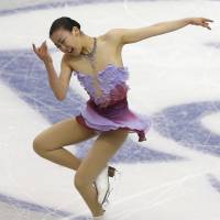 Not much competition: Mao Asada will bid for her third title at the world championships in Saitama next week against a field weakened by withdrawals following the Sochi Olympics. | AP