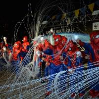 Children dressed as Spider-Man &#8212; the official goodwill ambassador of this year\'s Earth Hour switch-off campaign aimed at generating public awareness about global warming &#8212; cast webs Saturday evening in Yokohama, where the U.N.-sponsored Intergovernmental Panel on Climate Change met for five days through Saturday. | KYODO