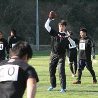 Follow the leader: Tomotsuna Inoue makes a pass during a practice session at the Tomotsuna Academy Football Camp. Inoue hopes to one day help a Japanese player break into the NFL. | KAZ NAGATSUKA