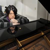 Composer Keiichiro Shibuya poses at a piano in his office in Tokyo’s Daikanyama district on Feb. 10. Composer Shibuya tests limits of music