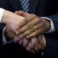 U.S. President Barack Obama shakes hands with European Council President Herman Van Rompuy and European Commission President Jose Manuel Barroso prior to a meeting in Brussels on Wednesday over Russia\'s Crimea grab. | AP