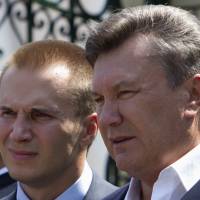 Ukraine\'s president at the time, Viktor Yanukovych (right), is pictured with his eldest son, Oleksandr, in April 2010. | REUTERS