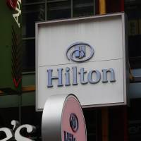 Hilton Hotel signs are displayed in New York in December. | BLOOMBERG