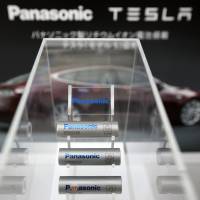 Lithium-ion batteries manufactured by Panasonic Corp. for the Model S electric vehicles built by Tesla Motors Inc. are displayed at Panasonic Center Tokyo last November. Panasonic hesitant about investing in Musk's huge Tesla battery factory