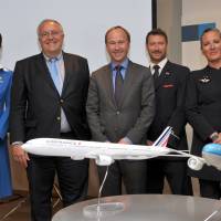 Air France-KLM Group Executive Vice President Patrick Alexandre (second from left) poses after a news conference in Tokyo on Wednesday. | YOSHIAKI MIURA