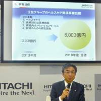 Masahiro Kitano, who will become senior vice president and chief of the health care business at Hitachi Ltd. in April, speaks at a news conference Monday in Tokyo. | KYODO