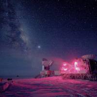 The 10-meter-wide South Pole telescope and the BICEP2 (Background Imaging of Cosmic Extragalactic Polarization) telescope at Amundsen-Scott South Pole Station is seen against the night sky with the Milky Way in August 2008. | REUTERS