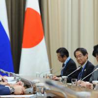 Russian President Vladimir Putin and Prime Minister Shinzo Abe meet in Sochi, Russia, on Feb. 8. | AP