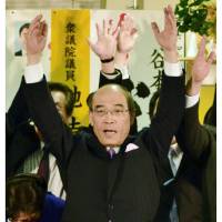 Ishikawa Gov. Masanori Tanimoto, who appeared assured of a sixth four-year term in Sunday\'s gubernatorial election, leads supporters in a lusty cry of \"Banzai!\" in Kanazawa. | KYODO