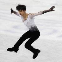 Storybook finish: Yuzuru Hanyu, competing in the free program on Friday night, lands eight triple jumps en route to a gold medal at the World Figure Skating Championships at Saitama Super Arena. | REUTERS